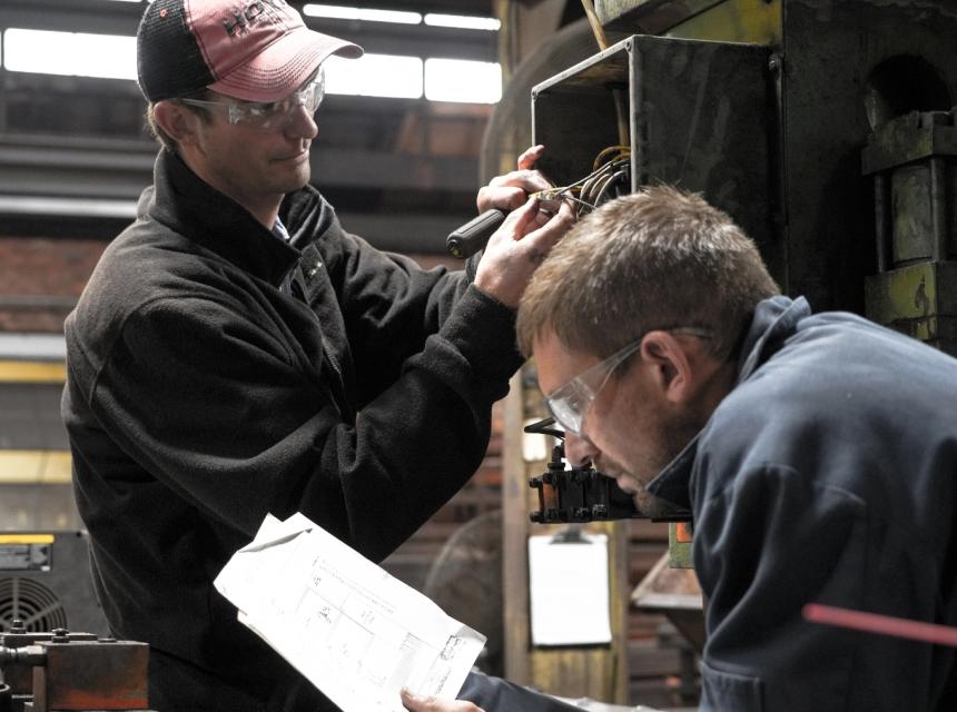 Two men working