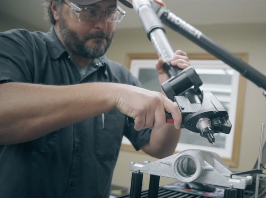 employee inspecting a part